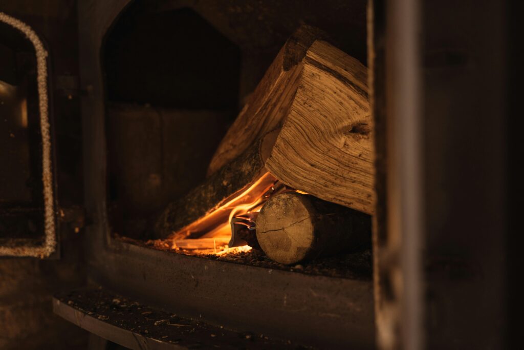 Cozy wood-burning fireplace in an Austin home after professional chimney cleaning by Texas Chimney Services.