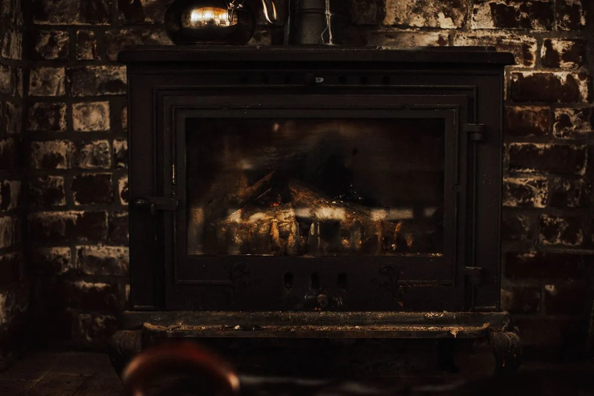 Wood fire burning in a brick fireplace